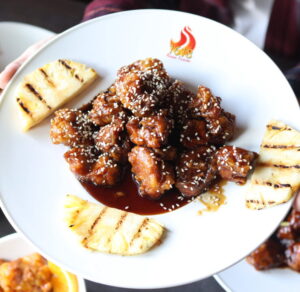 Honey glazed chicken with grilled pineapple slices