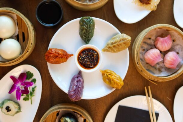 Colorful dumplings and sauce on a plate