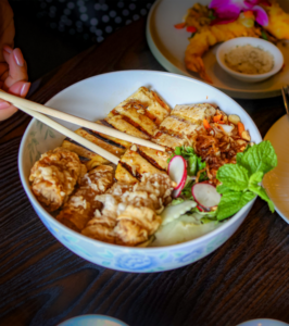Delicious tofu and chicken rice bowl with vegetables.